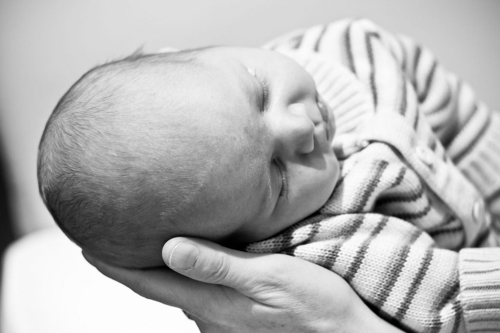 a newborn is sleeping during his session