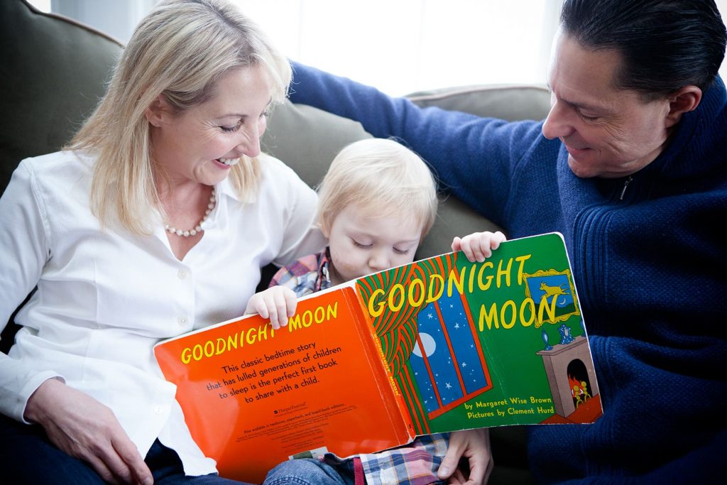 parents read their child Goodnight Moon