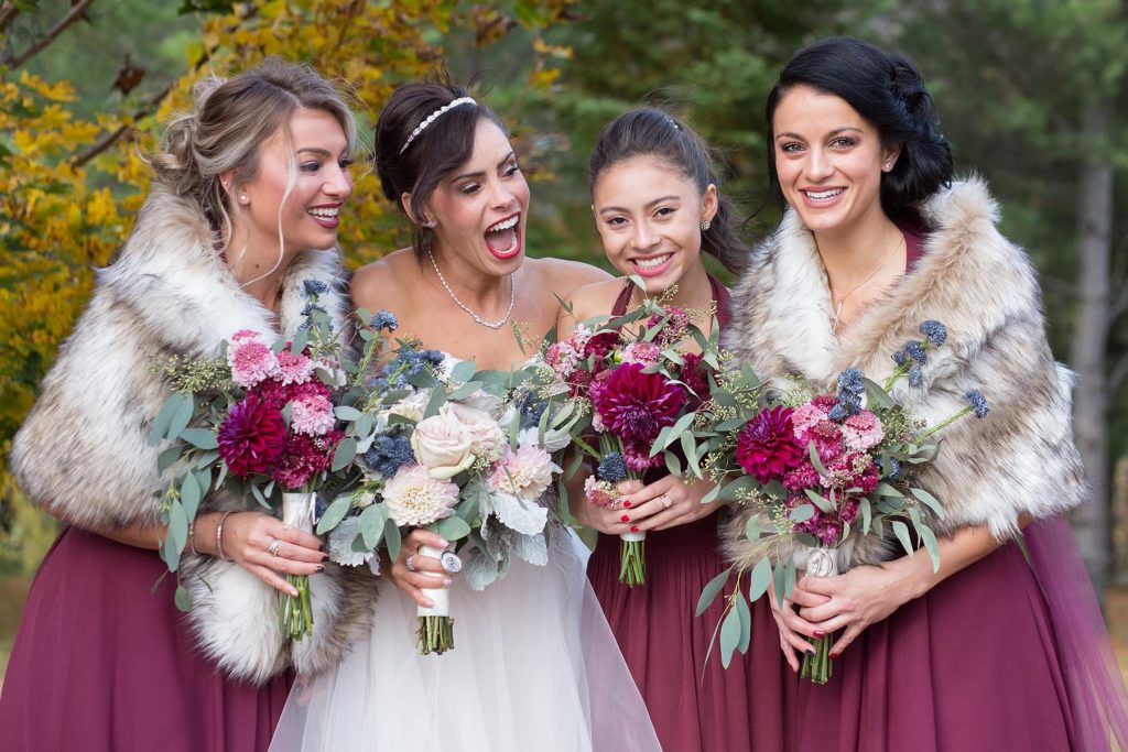 bridesmaids and maid of honor celebrate with their friend