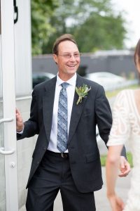 father welcomes bride on her wedding day
