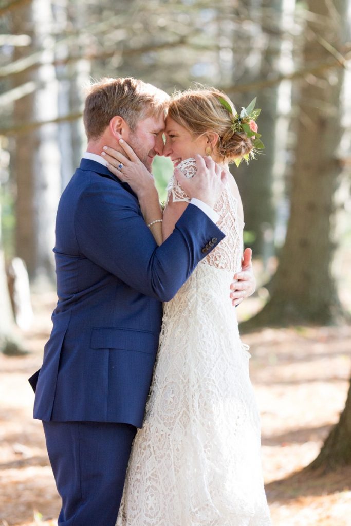 a sweet cuddle in the woods for new bride and groom