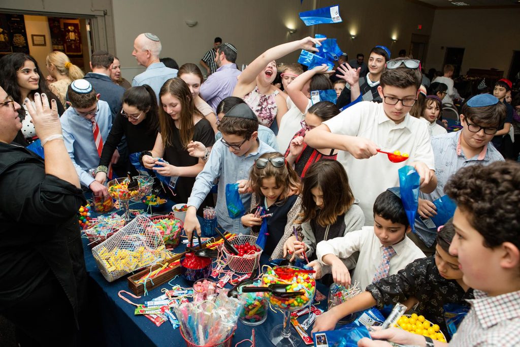 children enjoy a candy bar at a bar mitzvah party