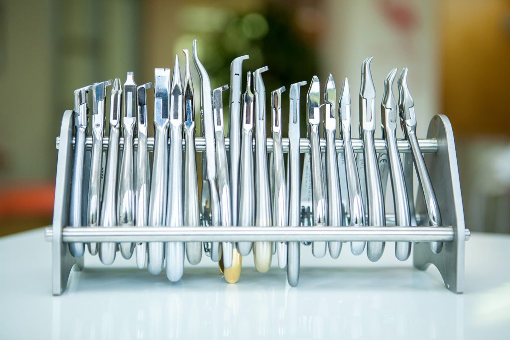 dentist tools are displayed on the counter in this artistic image